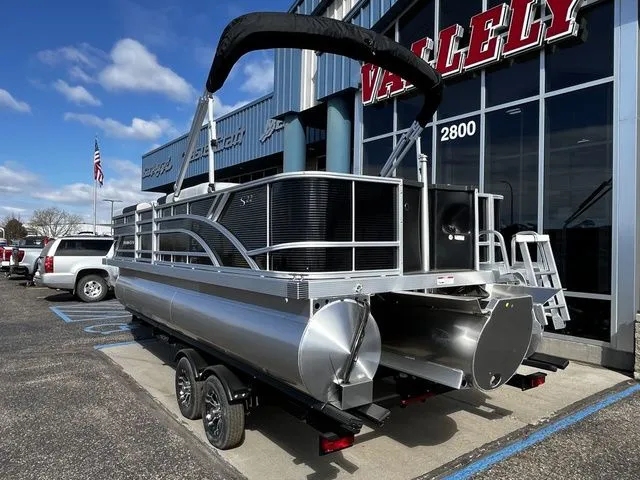 Slide: The Image of 2026 Bennington 22SFC S-One pontoon boat outside a building. - 3
