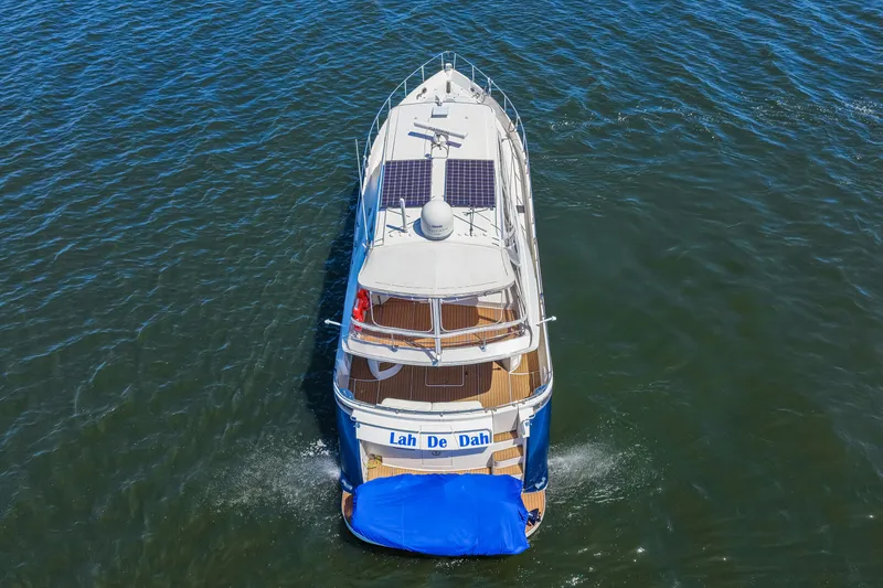 Slide: The Image of Aerial view of 2007 Marquis 59 Markham Edition yacht cruising on water. - 16