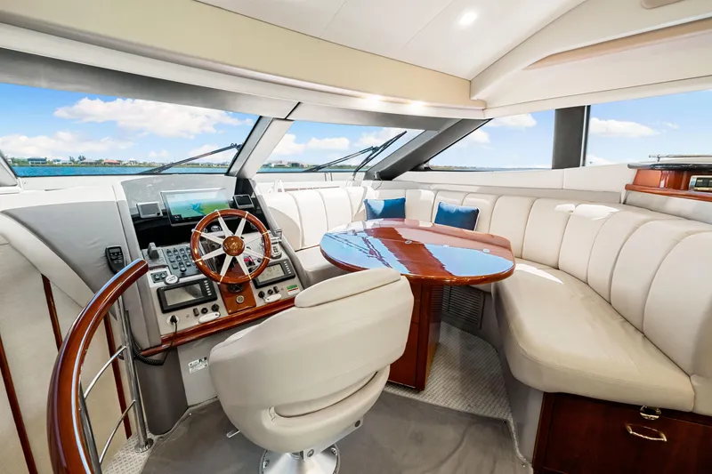 Slide: The Image of Luxurious 2007 Marquis 59 Markham Edition yacht interior with plush seating and elegant helm. - 181