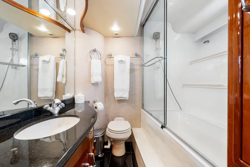 Slide: The Image of Luxurious bathroom in 2007 Marquis 59 Markham Edition yacht with modern fixtures and elegant design. - 191