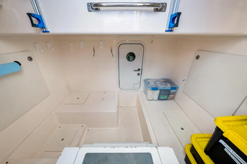 Slide: The Image of Interior of 2007 Marquis 59 Markham Edition yacht with storage compartments and supplies. - 196