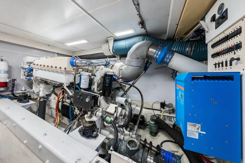 Slide: The Image of Engine room of 2007 Marquis 59 Markham Edition yacht, featuring complex machinery and control panels. - 199