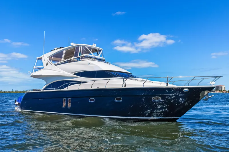 Slide: The Image of Luxury yacht Marquis 59 Markham Edition 2007 on open water under blue sky. - 20