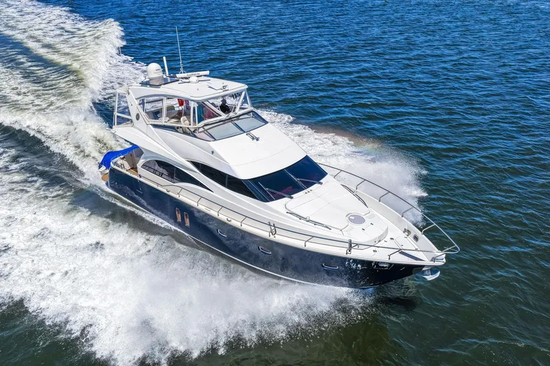 Slide: The Image of Luxurious 2007 Marquis 59 Markham Edition yacht cruising on open water. - 32