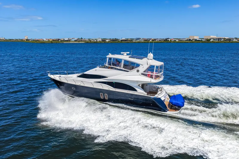 Slide: The Image of Luxury 2007 Marquis 59 Markham Edition yacht cruising on open water. - 39