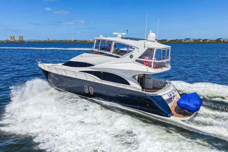 Slide: The Image of Luxurious 2007 Marquis 59 Markham Edition yacht cruising on open water. - 40