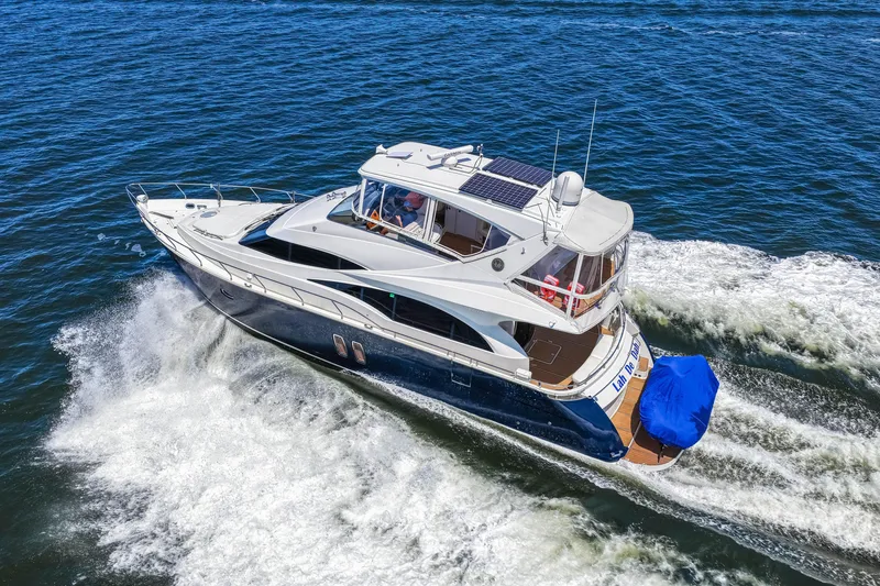 Slide: The Image of Luxurious 2007 Marquis 59 Markham Edition yacht cruising on open water. - 42