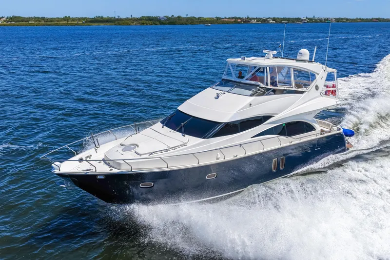 Slide: The Image of Luxury 2007 Marquis 59 Markham Edition yacht cruising on open water. - 44