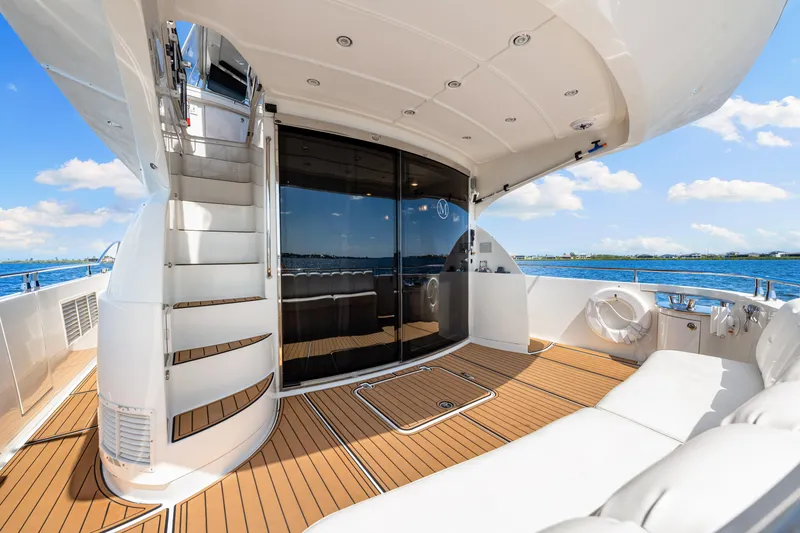Slide: The Image of Luxurious 2007 Marquis 59 Markham Edition yacht deck with elegant seating and ocean view. - 48
