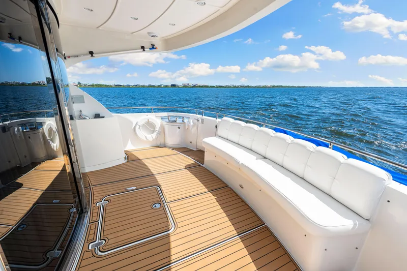 Slide: The Image of Luxurious 2007 Marquis 59 Markham Edition yacht deck with ocean view and plush seating. - 50