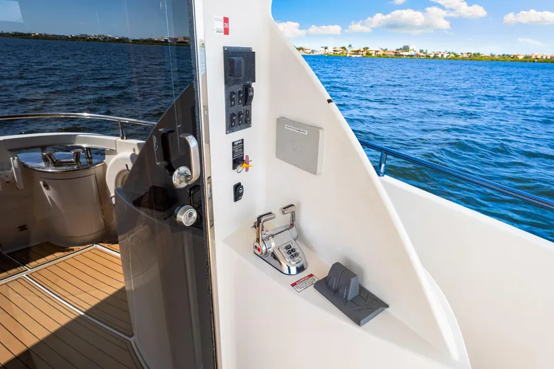 Slide: The Image of Luxury yacht Marquis 59 Markham Edition 2007, featuring sleek deck design and ocean view. - 52