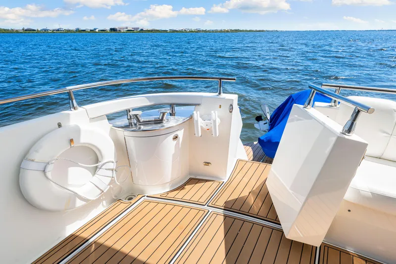 Slide: The Image of Luxury yacht deck of 2007 Marquis 59 Markham Edition, featuring teak flooring and ocean view. - 53