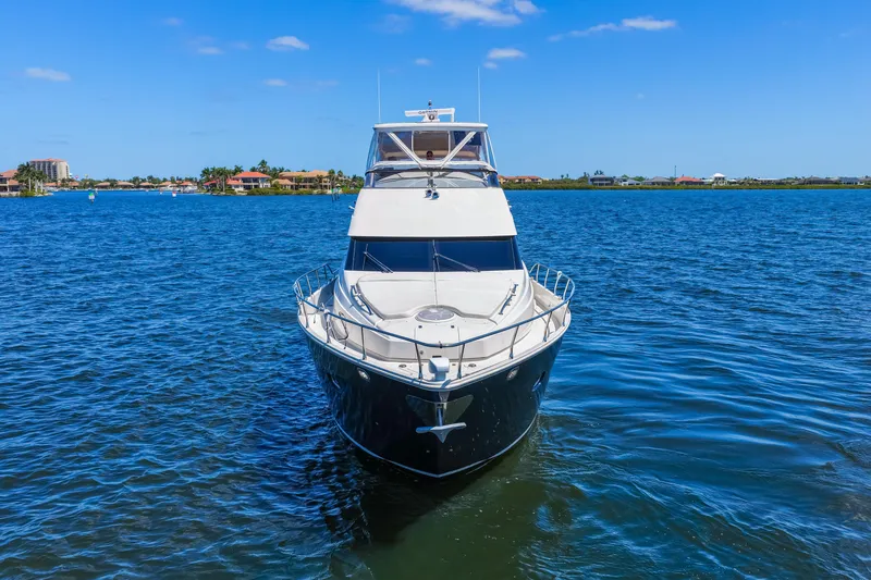 Slide: The Image of Luxury 2007 Marquis 59 Markham Edition yacht on serene blue waters. - 6