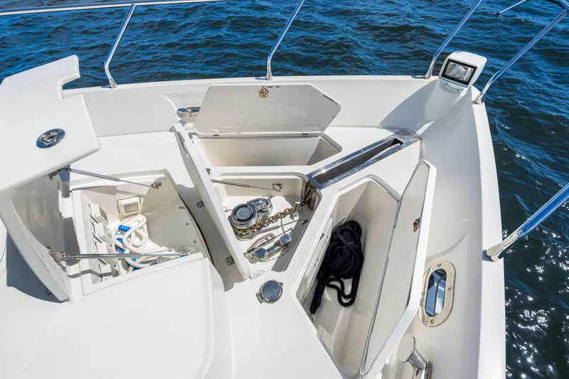 Slide: The Image of Open storage compartments on 2007 Marquis 59 Markham Edition yacht deck, with ropes and equipment. - 60