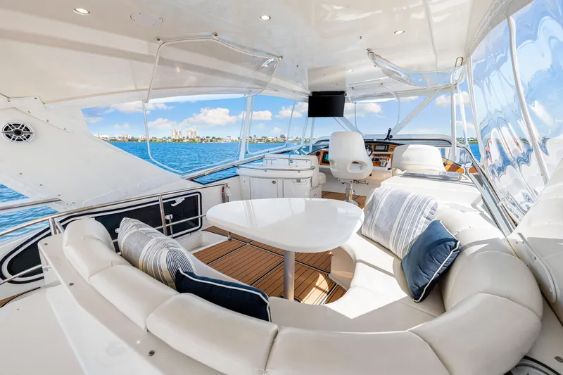 Slide: The Image of Luxurious 2007 Marquis 59 Markham Edition yacht interior with plush seating and ocean view. - 64