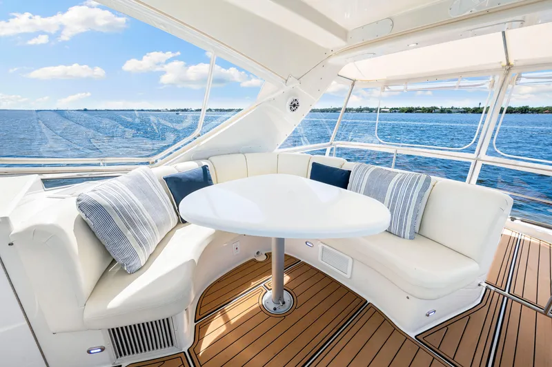 Slide: The Image of Luxurious 2007 Marquis 59 Markham Edition yacht interior with elegant seating and ocean view. - 65