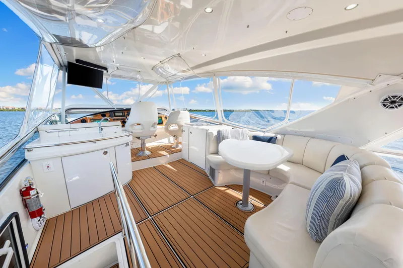 Slide: The Image of Luxurious 2007 Marquis 59 Markham Edition yacht interior with elegant seating and ocean view. - 67
