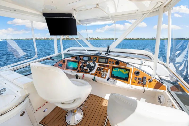 Slide: The Image of Luxurious 2007 Marquis 59 Markham Edition yacht cockpit with advanced navigation systems and scenic ocean view. - 71