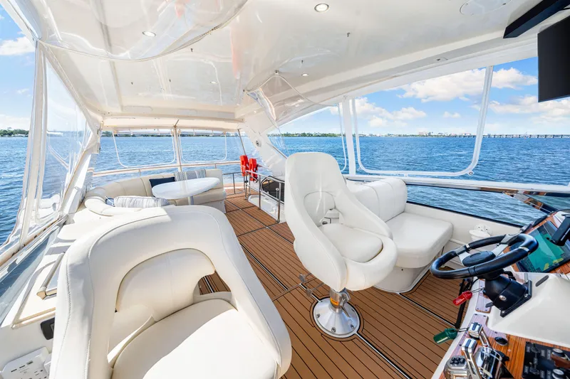 Slide: The Image of Luxurious 2007 Marquis 59 Markham Edition yacht interior with plush seating and scenic ocean view. - 73