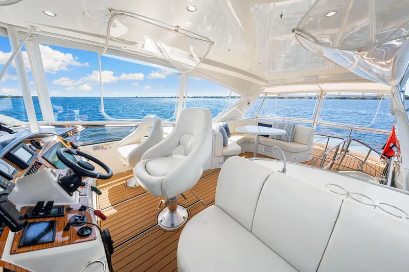 Slide: The Image of Luxurious 2007 Marquis 59 Markham Edition yacht interior with plush seating and ocean view. - 74