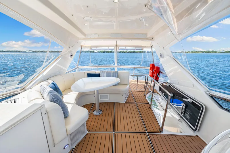 Slide: The Image of Luxurious 2007 Marquis 59 Markham Edition yacht interior with elegant seating and scenic ocean view. - 75