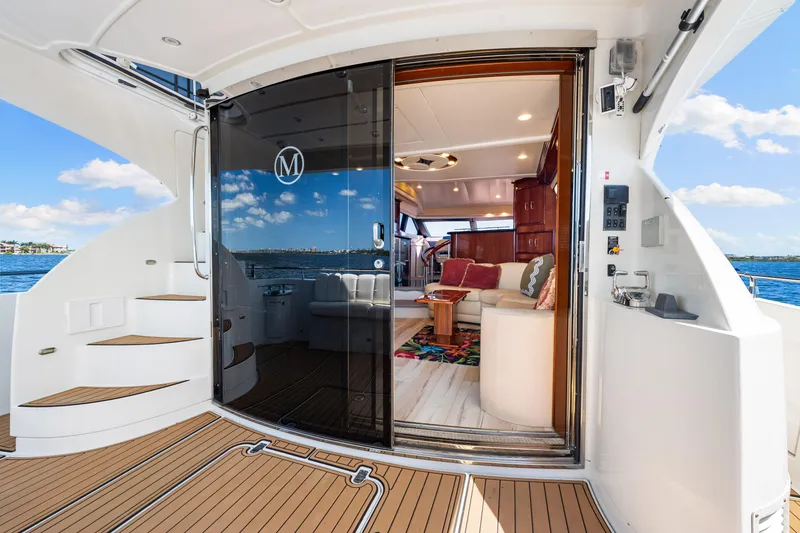Slide: The Image of Luxurious 2007 Marquis 59 Markham Edition yacht interior with elegant seating and ocean view. - 76