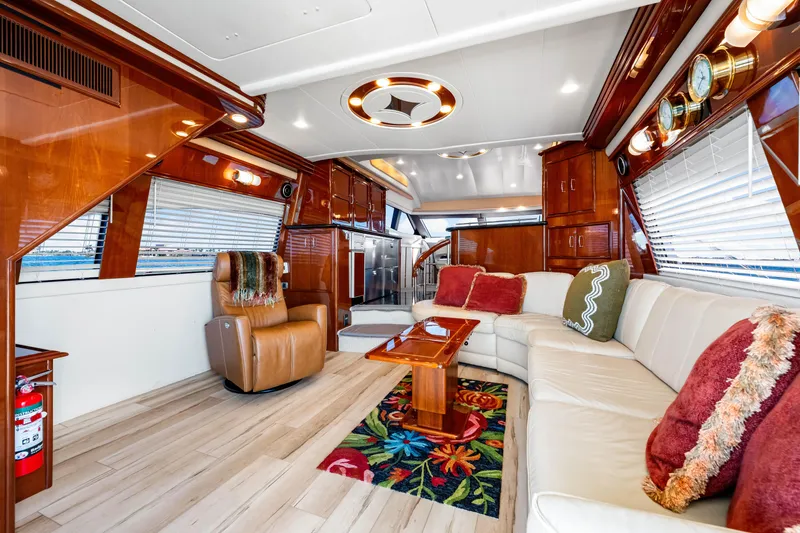 Slide: The Image of Luxurious interior of 2007 Marquis 59 Markham Edition yacht with plush seating and elegant wood finishes. - 77