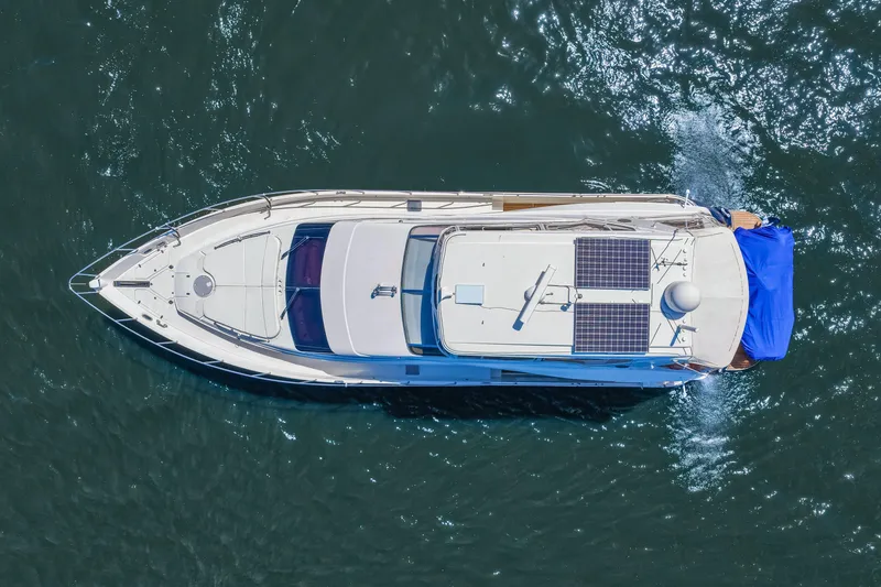 Slide: The Image of Aerial view of 2007 Marquis 59 Markham Edition yacht cruising on water. - 8