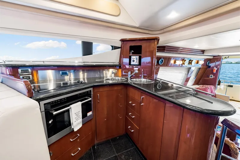 Slide: The Image of Luxurious kitchen interior of 2007 Marquis 59 Markham Edition yacht with modern appliances. - 82