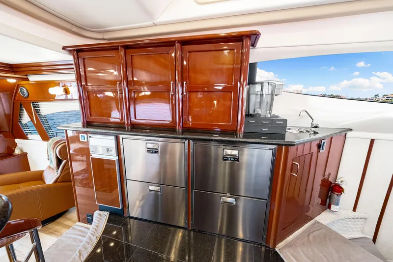 Slide: The Image of Luxurious 2007 Marquis 59 Markham Edition yacht interior with modern kitchen amenities. - 83