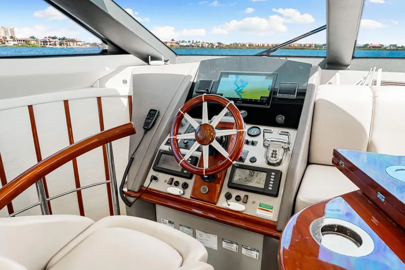 Slide: The Image of Luxurious 2007 Marquis 59 Markham Edition yacht helm with modern navigation equipment. - 86