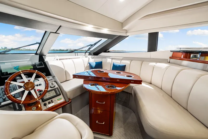 Slide: The Image of Luxurious interior of 2007 Marquis 59 Markham Edition yacht with plush seating and elegant helm. - 87