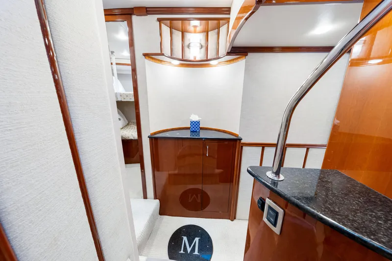 Slide: The Image of Luxurious interior of 2007 Marquis 59 Markham Edition yacht with elegant wood finishes. - 90