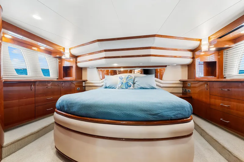 Slide: The Image of Luxurious 2007 Marquis 59 Markham Edition yacht bedroom with elegant wood finishes and ocean views. - 92