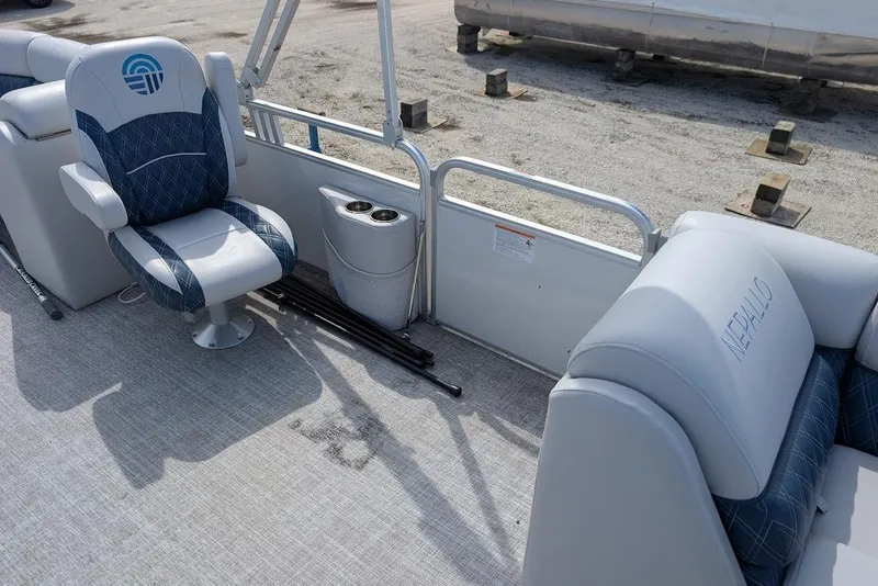 Slide: The Image of 2022 Nepallo 22QL boat interior with cushioned seating and cup holders. - 11