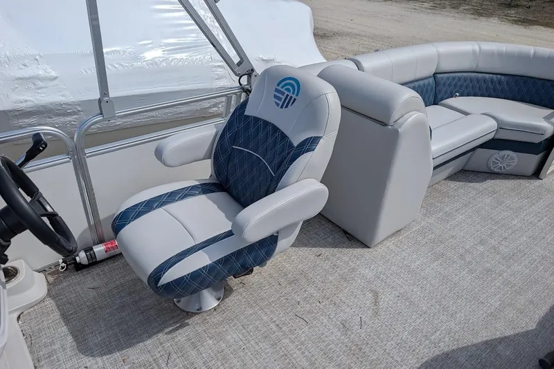 Slide: The Image of 2022 Nepallo 22QL boat interior with plush seating and steering wheel. - 12