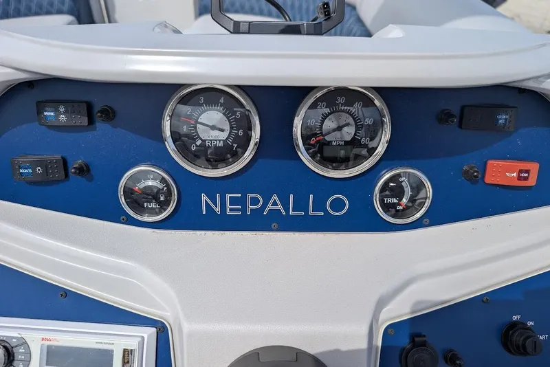 Slide: The Image of Dashboard of a 2022 Nepallo 22QL boat with gauges and controls. - 14