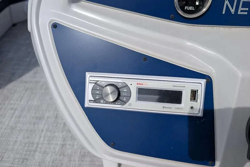 Slide: The Image of Control panel of a 2022 Nepallo 22QL boat featuring a Boss audio system. - 16