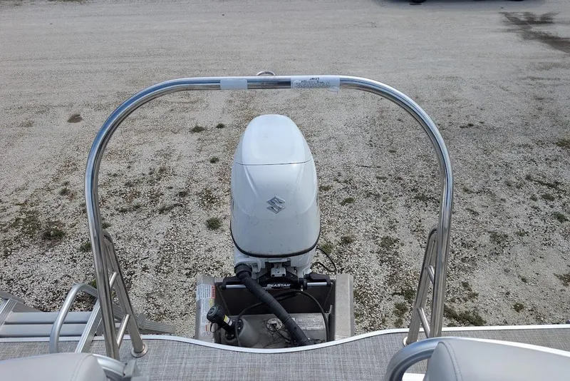 Slide: The Image of 2022 Nepallo 22QL boat with Suzuki outboard motor on gravel surface. - 20