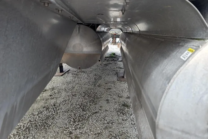 Slide: The Image of Underneath view of a 2022 Nepallo 22QL pontoon boat on gravel. - 21