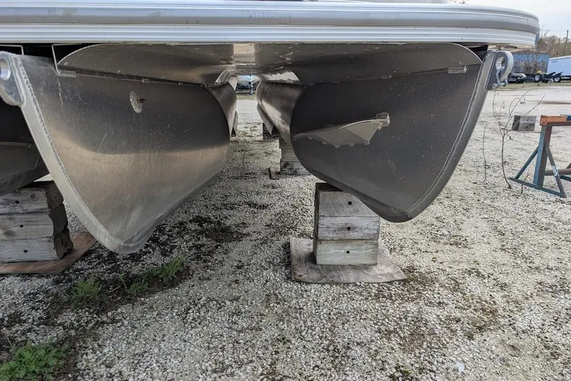Slide: The Image of Underneath view of a 2022 Nepallo 22QL pontoon boat on wooden blocks. - 23