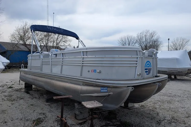 Slide: The Image of 2022 Nepallo 22QL pontoon boat with canopy, parked outdoors, marked as sold. - 5