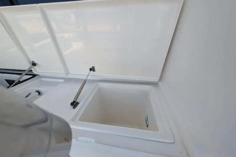 Slide: The Image of Open storage compartment on a 2005 Egg Harbor 43 SportYacht. - 100