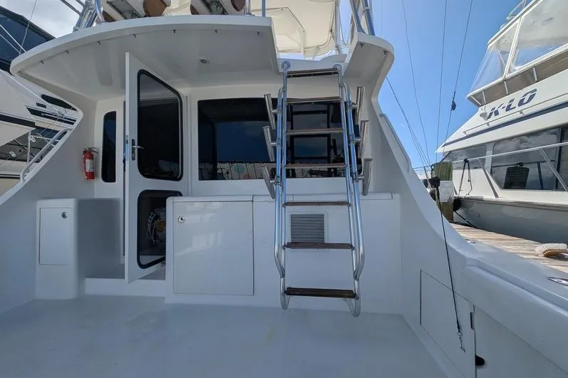 Slide: The Image of 2005 Egg Harbor 43 SportYacht with ladder and open door on deck. - 102