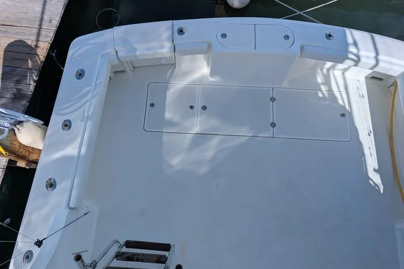 Slide: The Image of 2005 Egg Harbor 43 SportYacht deck, featuring spacious layout and storage compartments. - 106