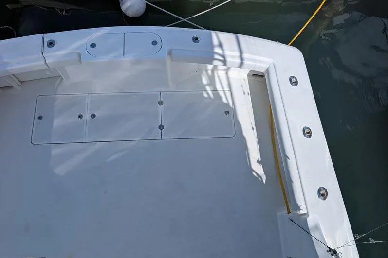 Slide: The Image of 2005 Egg Harbor 43 SportYacht deck with storage compartments and mooring lines. - 107