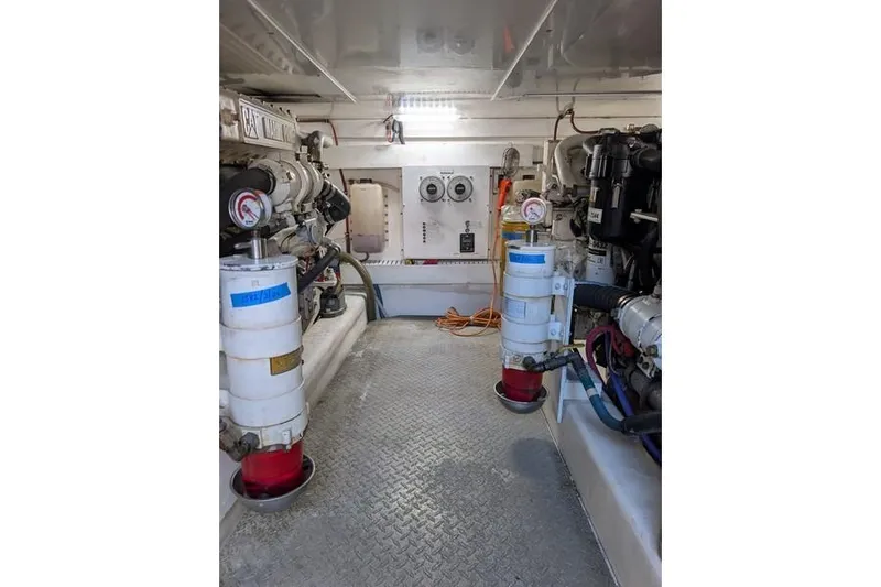 Slide: The Image of Engine room of 2005 Egg Harbor 43 SportYacht with mechanical equipment and gauges. - 108