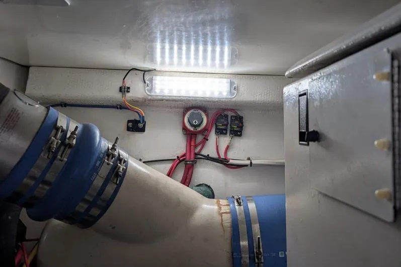 Slide: The Image of Engine room of 2005 Egg Harbor 43 SportYacht with visible wiring and components. - 116