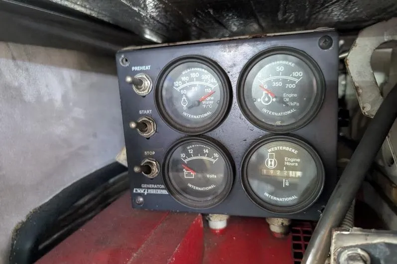 Slide: The Image of Control panel of a 2005 Egg Harbor 43 SportYacht with gauges and switches. - 120