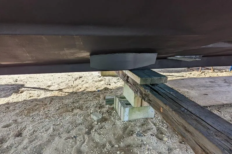 Slide: The Image of Bottom view of a 2005 Egg Harbor 43 SportYacht on wooden supports. - 13